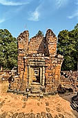 Angkor - Eastern Mebon - towered passageways leading to the first enclosure of the temple,  with stone lions guarding the entrance.